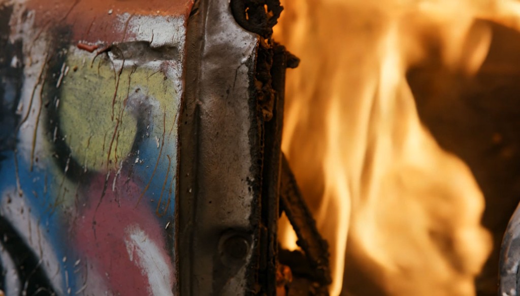 Birth — graffiti-covered metal burning