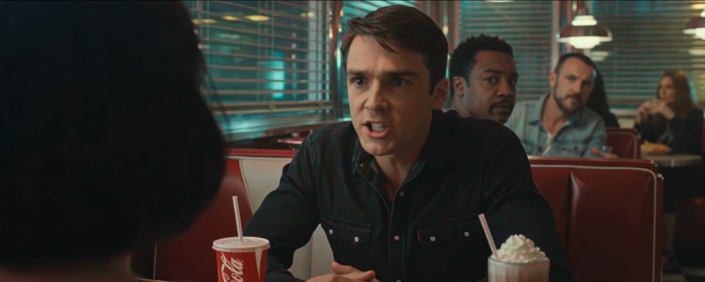 WIZE Can do comedy — young man arguing in a diner booth