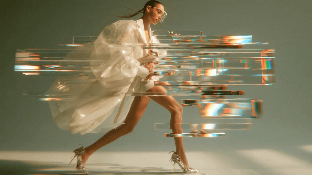 WIZE Fashion — model running through shards of glass and light
