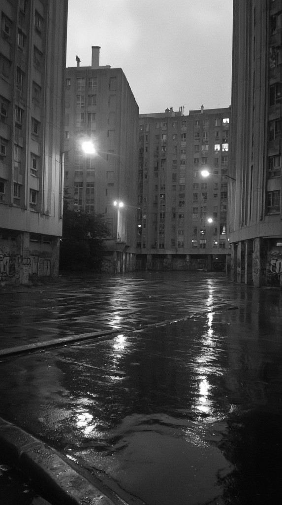 No Zone — wet courtyard at night with streetlights