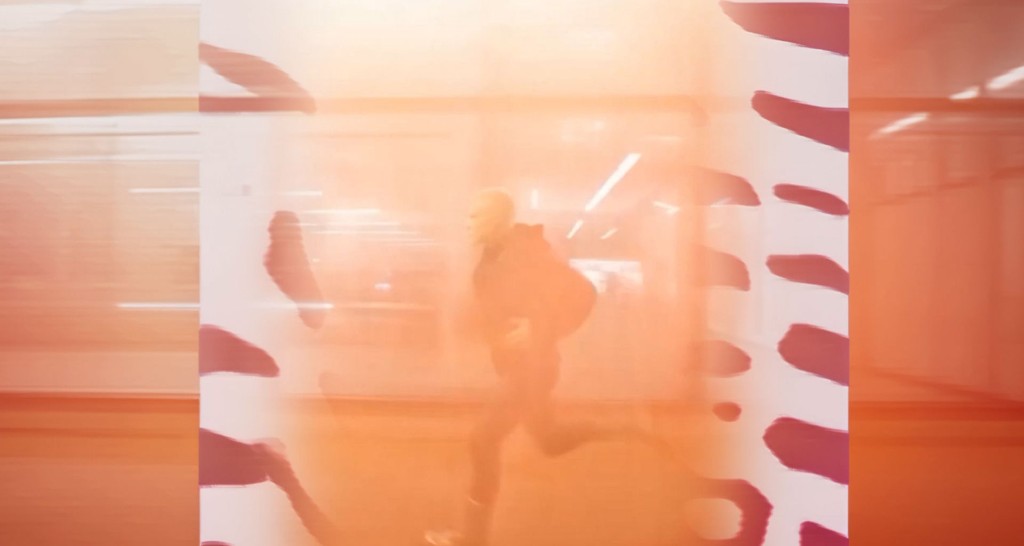 Rave — figure running through an orange corridor