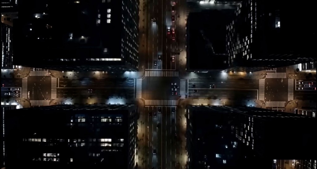 Rave — aerial night view of a city crossroads