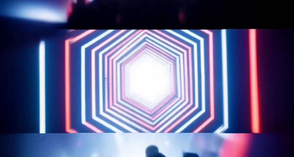 Rave — neon hexagonal tunnel on a stage screen